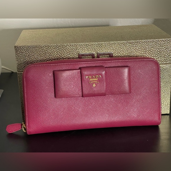 Prada Handbags - Authentic Prada Saffiano Bow Zip Around Wallet
